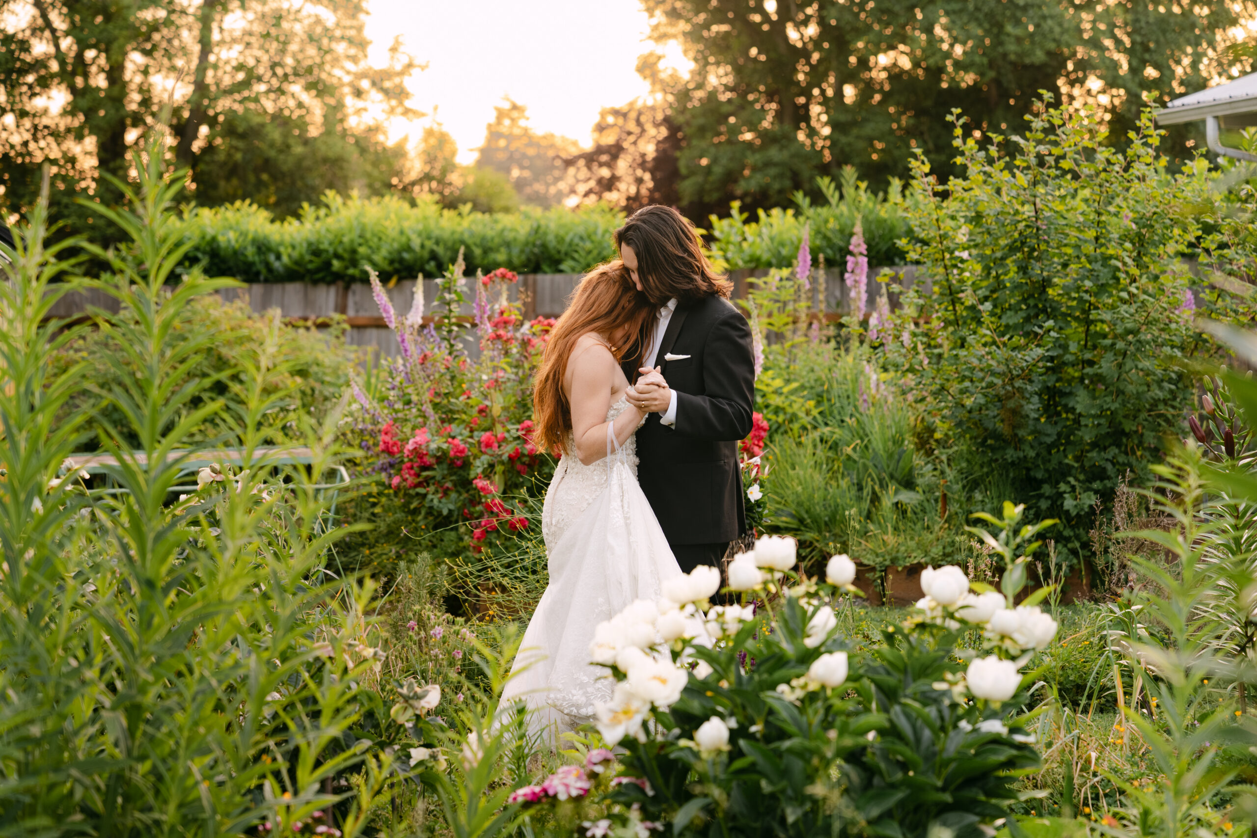 Wedding couple having a sunset dance to their song, in the nursery at Stepping Stones Garden, Snohomish Washington