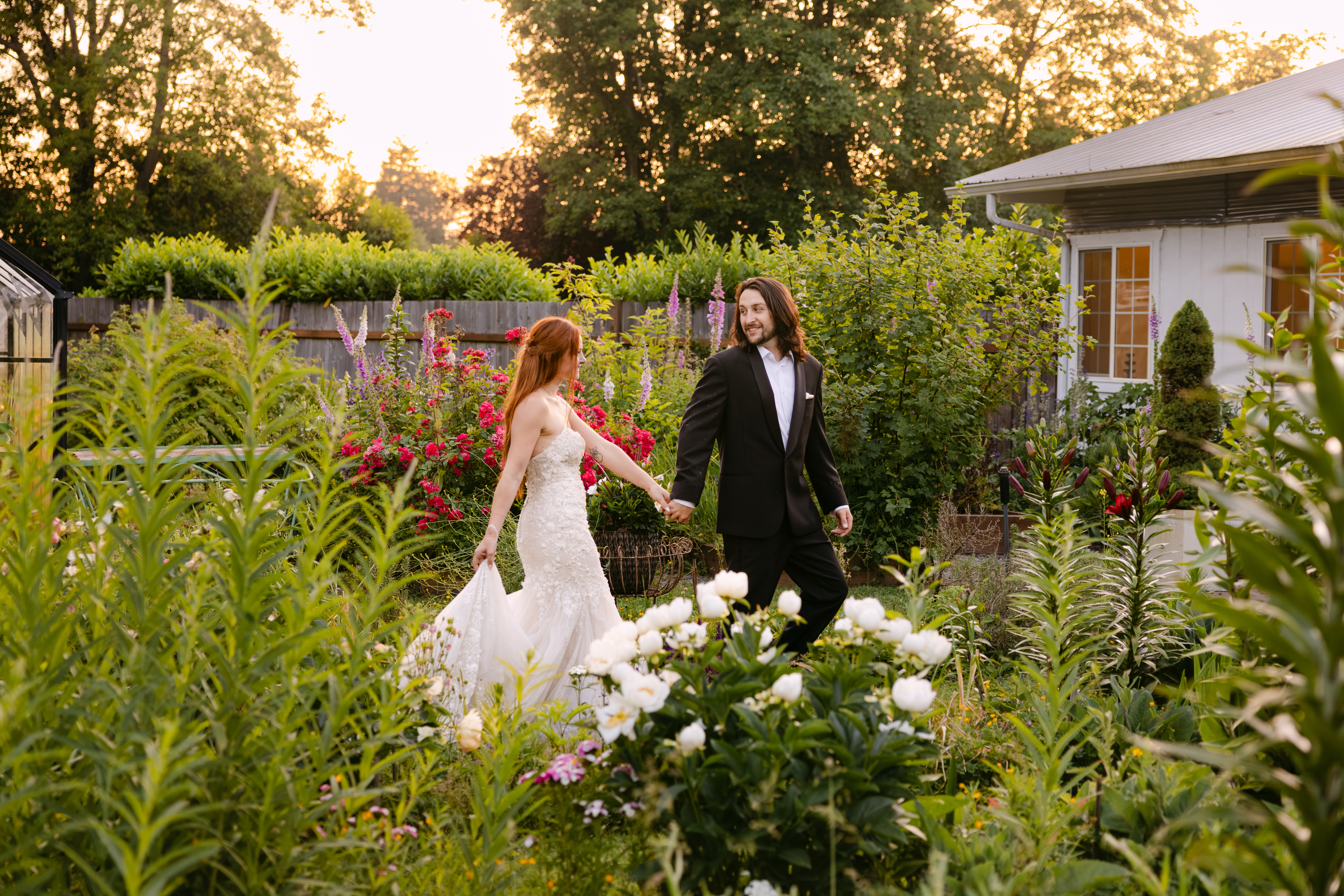 Wedding couple having a sunset dance to their song, in the nursery at Stepping Stones Garden, Snohomish Washington